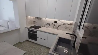 a small kitchen with a counter and a sink at V32 - Athens Central Fully Equipped Apartment in Athens
