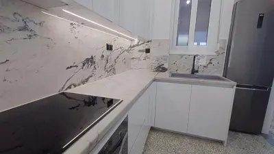 a white kitchen with a sink and a counter at V32 - Athens Central Fully Equipped Apartment in Athens