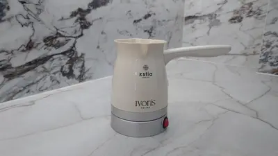 a white electric blender sitting on a marble counter at V32 - Athens Central Fully Equipped Apartment in Athens