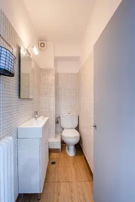 a bathroom with a toilet and a sink at Villa Costa Luca in Vouliagmeni in Athens