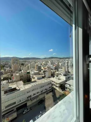 a view of a city from an office window at Urban Utopia in Athens