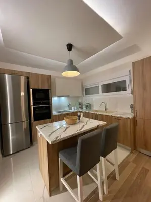a kitchen with a island with a bowl on it at Urban Utopia in Athens