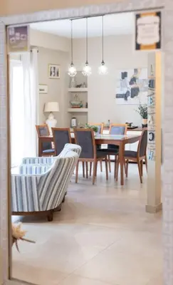 a dining room with a table and chairs at Renovated fully equipped 2 Bedroom cozy Apartment near the sea in Athens