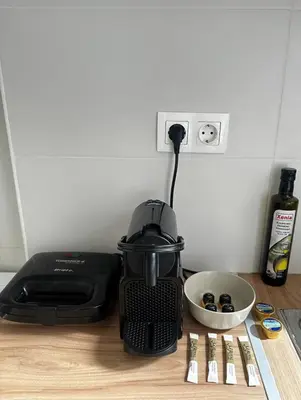a kitchen counter with a toaster and a bowl of food at Petralona modern apartment near metro & Acropolis in Athens