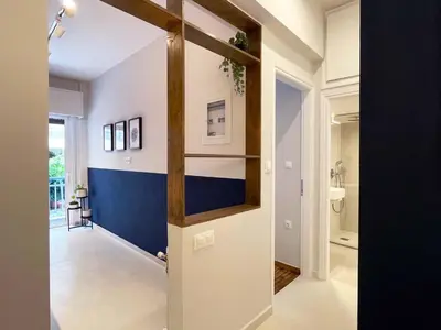 a hallway with a door leading to a bathroom at Marmaronetta in Athens