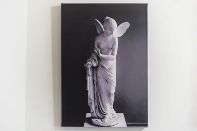 a statue of an angel holding an umbrella at Acropolis Walk Residence by MDK Athens in Athens