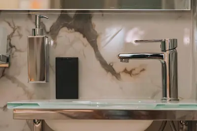 a sink with a faucet in a bathroom at Gazi Suite with Private Rooftop in Athens
