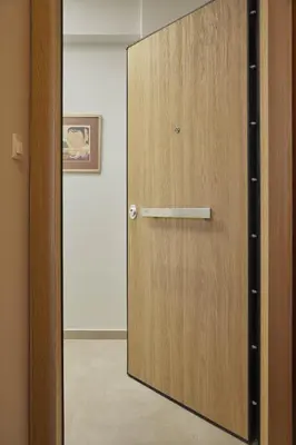 a wooden door with a mirror in a room at Filolaou Athens Luxury Apartment by Mystery in Athens