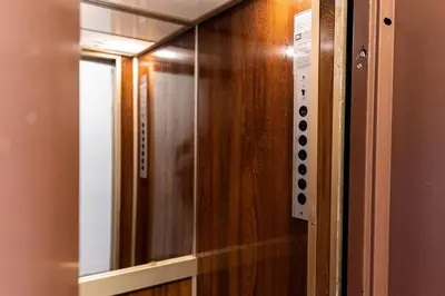 a glass door of a elevator in a room at Historical center Athens amazing studio in Athens