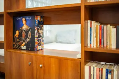 a book sitting on a shelf with books at Inviting Flat near Acropolis in Athens