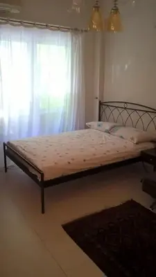 a bed sitting in a bedroom with a window at Μοντέρνος χώρος στο κέντρο της πόλης in Athens