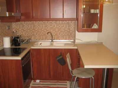 a kitchen with a sink and a chair in it at Μοντέρνος χώρος στο κέντρο της πόλης in Athens