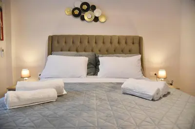 a bedroom with a large bed with two pillows at Ηλιόλουστο in Athens