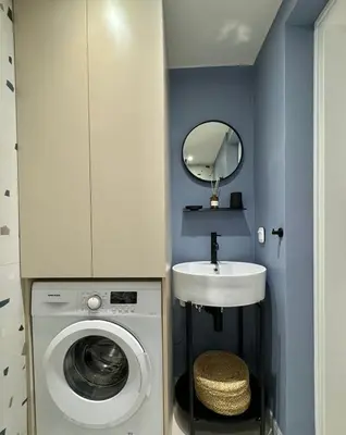 a bathroom with a washing machine and a sink at Microhome in Philopappos Hill in Athens