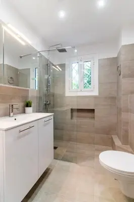 a bathroom with a toilet and a shower and a sink at Ella's Cozy escape with balcony! in Athens