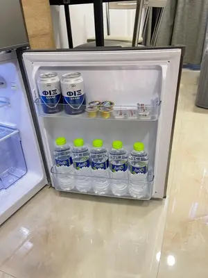 an open refrigerator filled with bottles of water at Arame Luxury Apartments in Athens