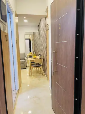 a hallway with a wooden door and a table at Narek luxury Apartment's in Athens