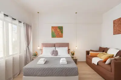 a bedroom with a bed and a couch at M18 Studios Monastiraki Gems in Athens