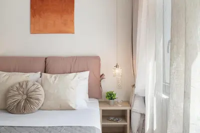 a bedroom with a bed with white pillows at M18 Studios Monastiraki Gems in Athens