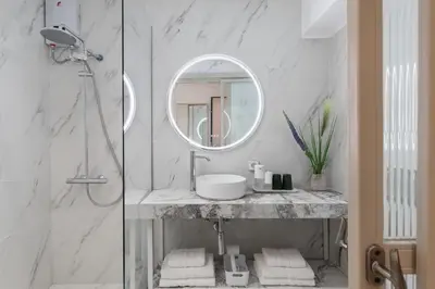 a bathroom with a sink and a mirror at M18 Studios Monastiraki Gems in Athens