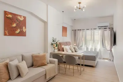 a living room with a couch and a bed at M18 Studios Monastiraki Gems in Athens