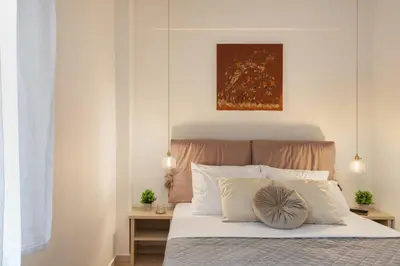 a bedroom with a bed with white pillows at M18 Studios Monastiraki Gems in Athens