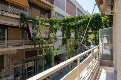 a balcony with ivy on the side of a building at LIV - Peaceful Pagrati Getaway in Athens