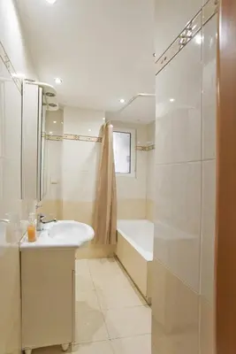 a white bathroom with a sink and a shower at Seaside Spacious 2 BR, 2BA, Sea view Apt in Piraeus