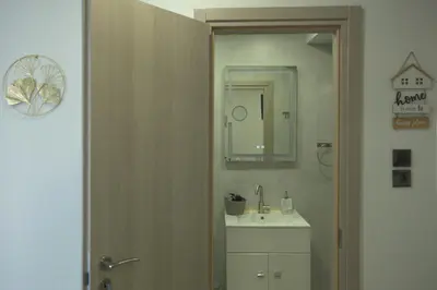 a bathroom with a sink and a mirror at Athens Dream in Athens