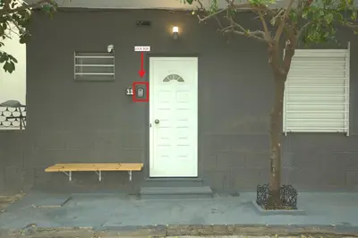 a white door with a bench next to a house at Athens Dream in Athens