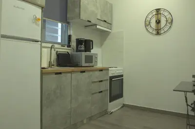 a kitchen with a refrigerator and a microwave at Athens Dream in Athens