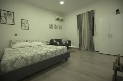 a bedroom with a bed and a couch at Athens Dream in Athens