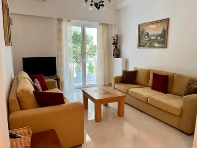 a living room with two couches and a coffee table at TOMS apartment Acropolis district in Athens