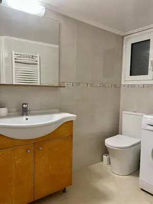 a bathroom with a sink and a toilet at TOMS apartment Acropolis district in Athens