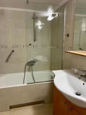 a bathroom with a bath tub and a sink at TOMS apartment Acropolis district in Athens