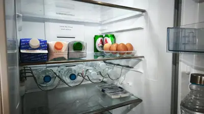 a refrigerator with its door open with food in it at Vintage house by the sea in althea in Aghia Marina