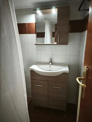 a bathroom with a sink and a mirror at Vintage house by the sea in althea in Aghia Marina