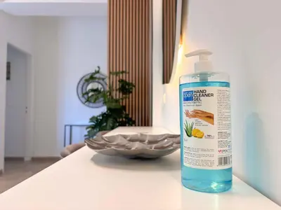 a bottle of fish cleaner sitting on a counter at Cozy Flat near Glyfada Center in Athens