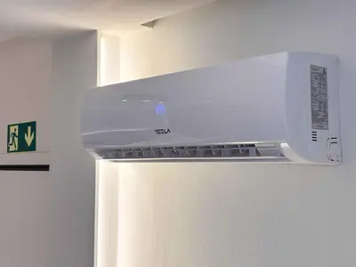 a microwave oven sitting on top of a refrigerator at Cozy Flat near Glyfada Center in Athens