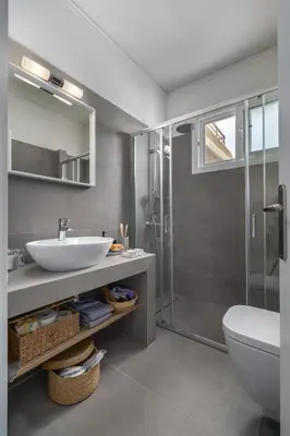 a bathroom with a sink and a shower at The rock view apartment in Athens