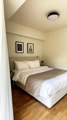 a bedroom with a large white bed in a room at The White Marble - Spacious, 4BR, 2BA in Paleo Faliro in Athens