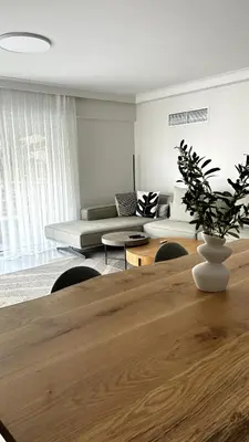 a living room with a table and a couch at The White Marble - Spacious, 4BR, 2BA in Paleo Faliro in Athens