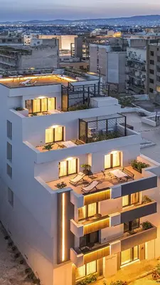 an apartment building with lights on top of it at The Meta Stay - Rooftop Access Downtown Studio in Athens