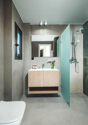 a bathroom with a sink and a mirror at The Meta Stay - Rooftop Access Downtown Studio in Athens
