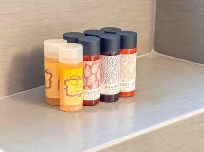 four bottles of spices sitting on a shelf at Light & Spacious Apartment near Glyfada Center in Athens