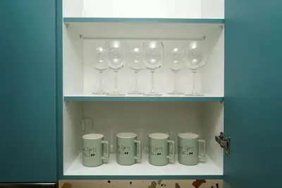 a row of wine glasses on a shelf at Modern Style Suite VIPGreece in Athens