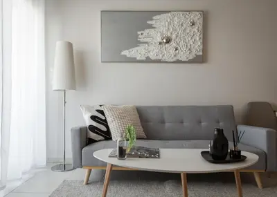 a living room with a couch and a coffee table at Athenian Comfort Apartments in Athens