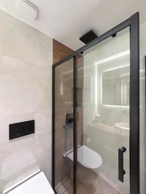 a bathroom with a shower with a toilet and a sink at A modern temple of Athena 1 & 2 in Athens