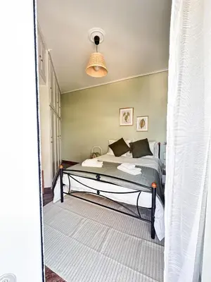 a bedroom with a bed in a room at Sea the City - Chic 2-BDR Escape with Spacious Living in Athens