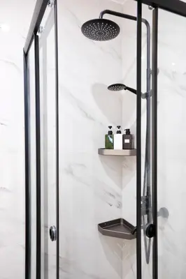 a shower stall with a toilet in a bathroom at Cozy Home With Cooking Near Tram in Piraeus